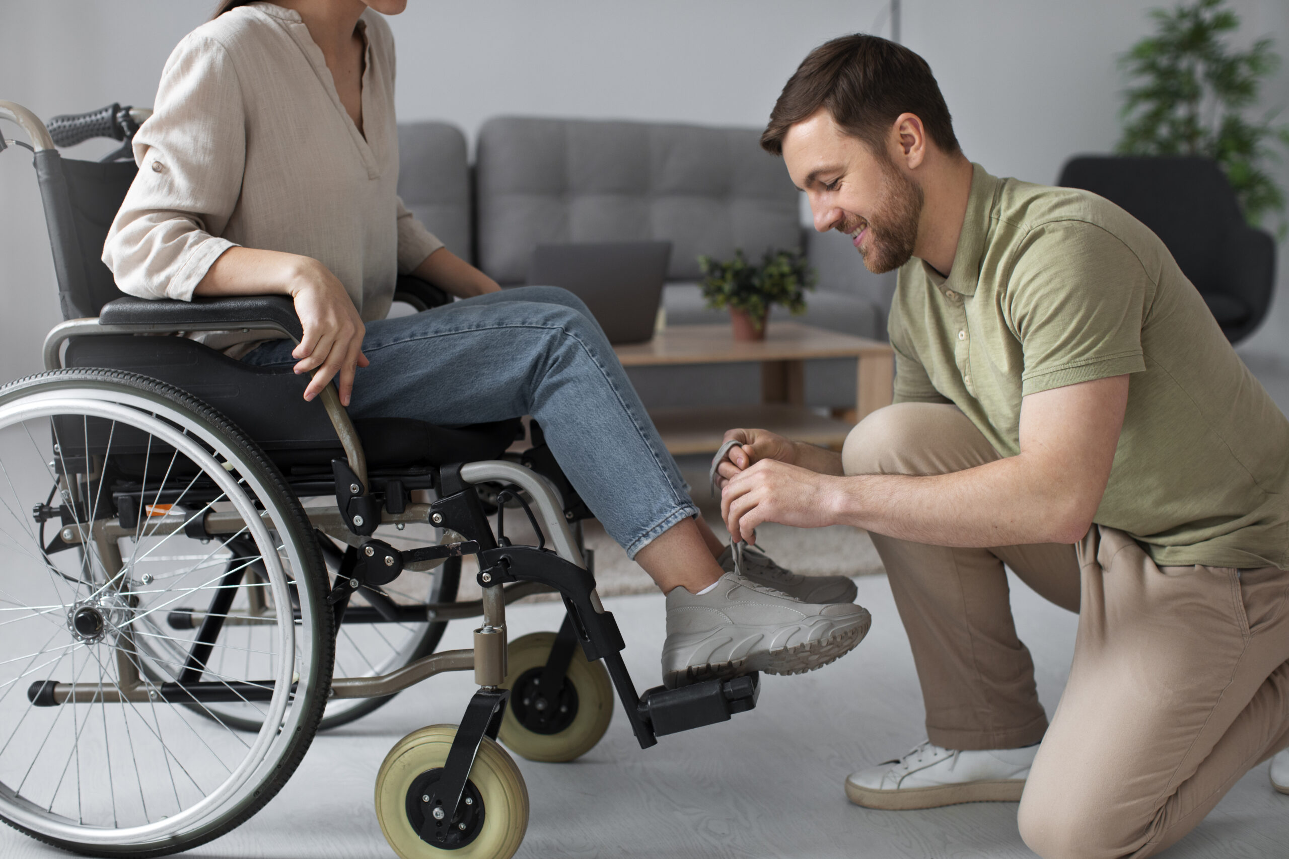 young-adult-helping-disabled-friend